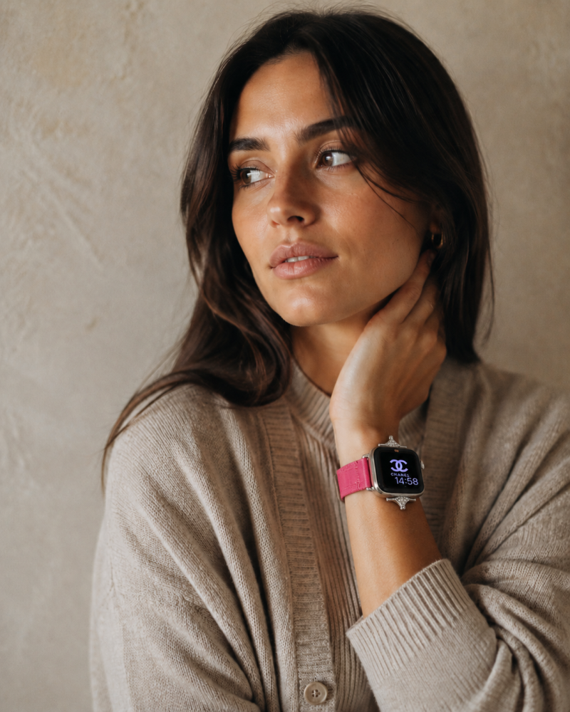 Woman wearing smartwatch with crimson leather strap on wrist