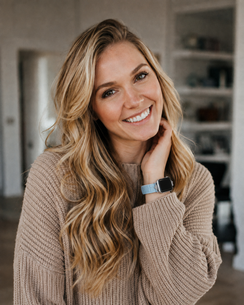 Woman wearing Sophia leather strap smartwatch in lake blue color