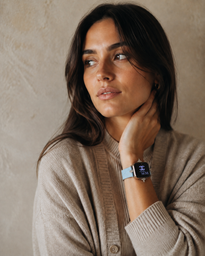 Woman wearing Sophia leather strap smartwatch in lake blue on wrist