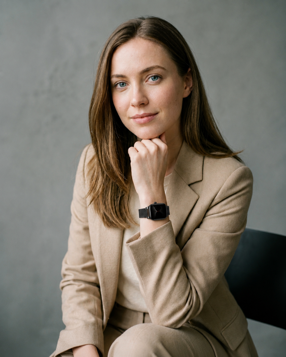 Woman wearing beige blazer with black magnetic strap Apple Watch band