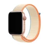 Rose gold Apple Watch with cream and orange sport loop band