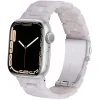 Silver smartwatch with pearl white crystal band and black dial display