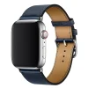 Silver smartwatch with navy blue leather band and buckle closure