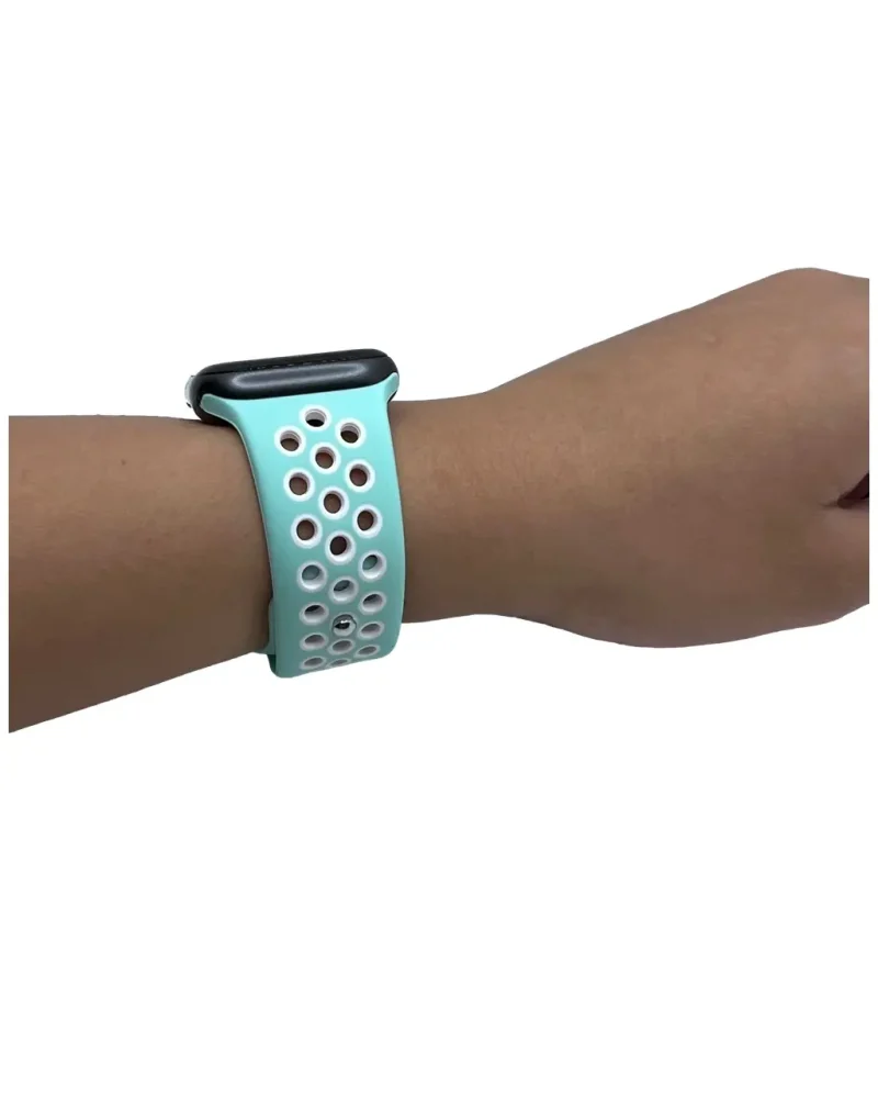 Turquoise perforated silicone sports watch band on wrist, breathable design