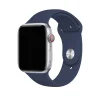 Silver smartwatch with midnight blue sport band and red digital crown
