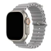 Silver titanium smartwatch with concrete gray ocean band and orange digital crown