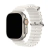 White silicone ocean band smartwatch with titanium case and orange accent button