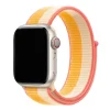 Apple Watch with colorful maize white sport loop band featuring pink accents