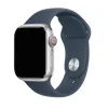 Silver smartwatch with storm blue sport band and red digital crown