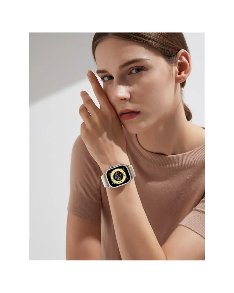 White and yellow digital smartwatch with square face on woman's wrist